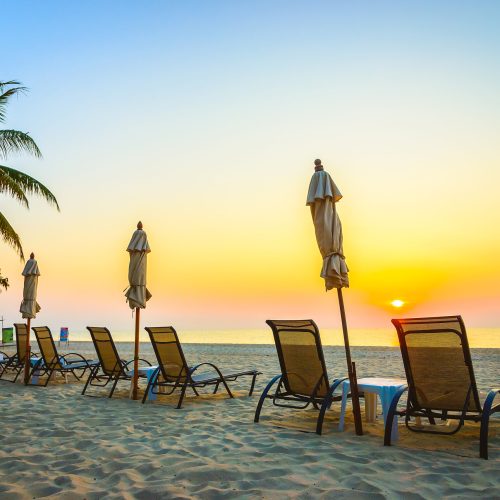 Beach chair with sunrise on twilight time - vintage filter